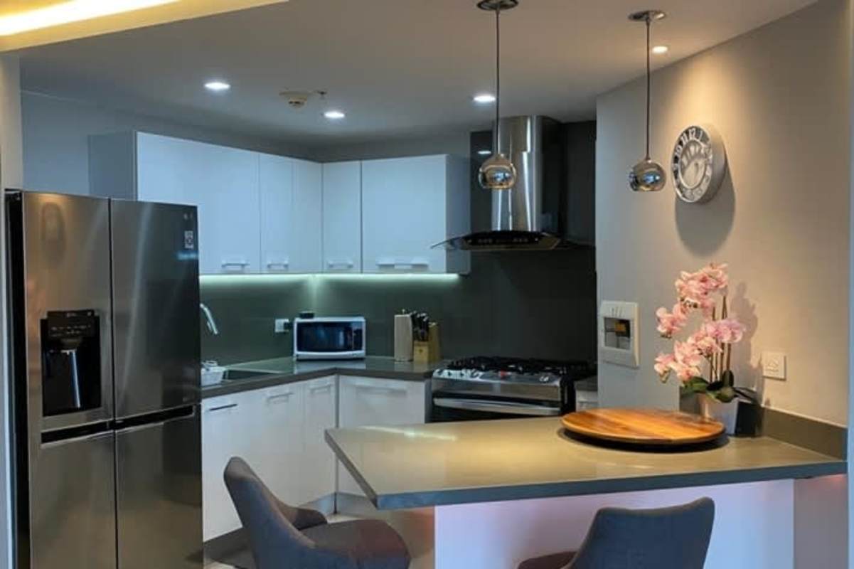 Contemporary kitchen with quartz countertop and stainless appliances PH Ocean House Costa del Este