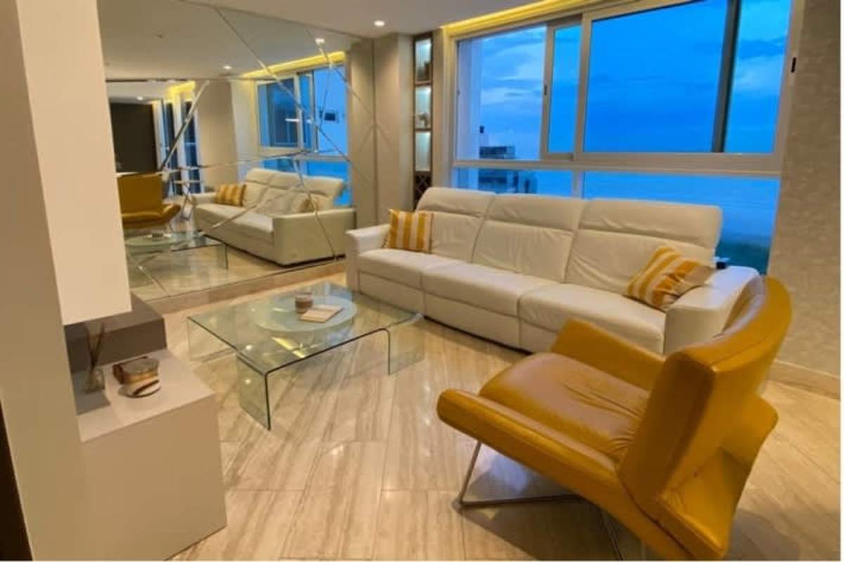 Bright living room with panoramic ocean views at PH Ocean House Costa del Este Panama City