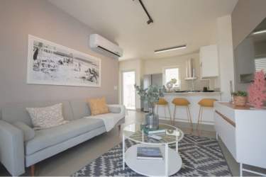 Bright modern bedroom with large window and built-in closet The Tides Playa Caracol Panama