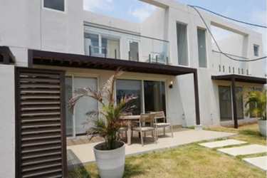 Modern two-level villa exterior at The Tides beachfront community, Playa Caracol Panama