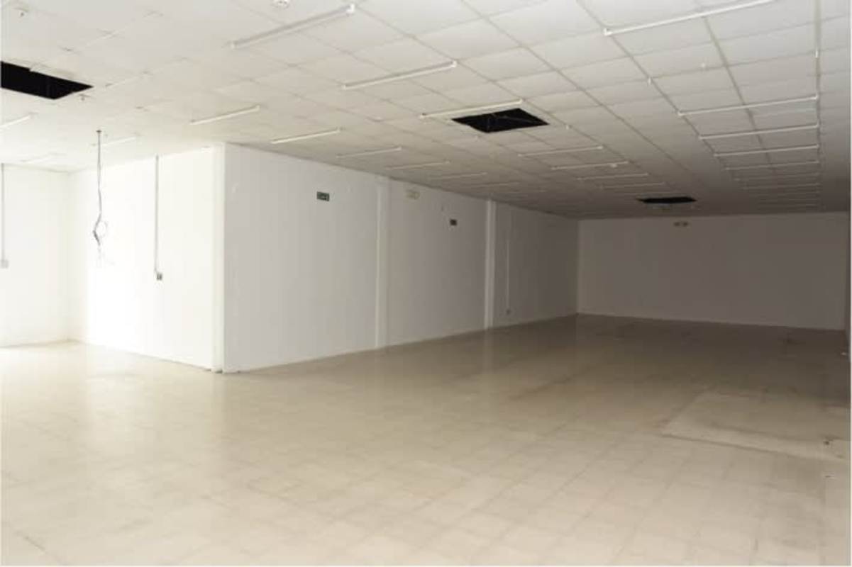 Empty commercial retail or office space with tiled flooring and lighting panels PH Cangrejo Plaza Panama City