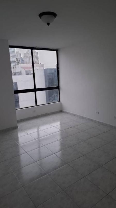 Kitchen with granite countertop, cabinets, stove and microwave in PH Ocean Sky Punta Paitilla Panama