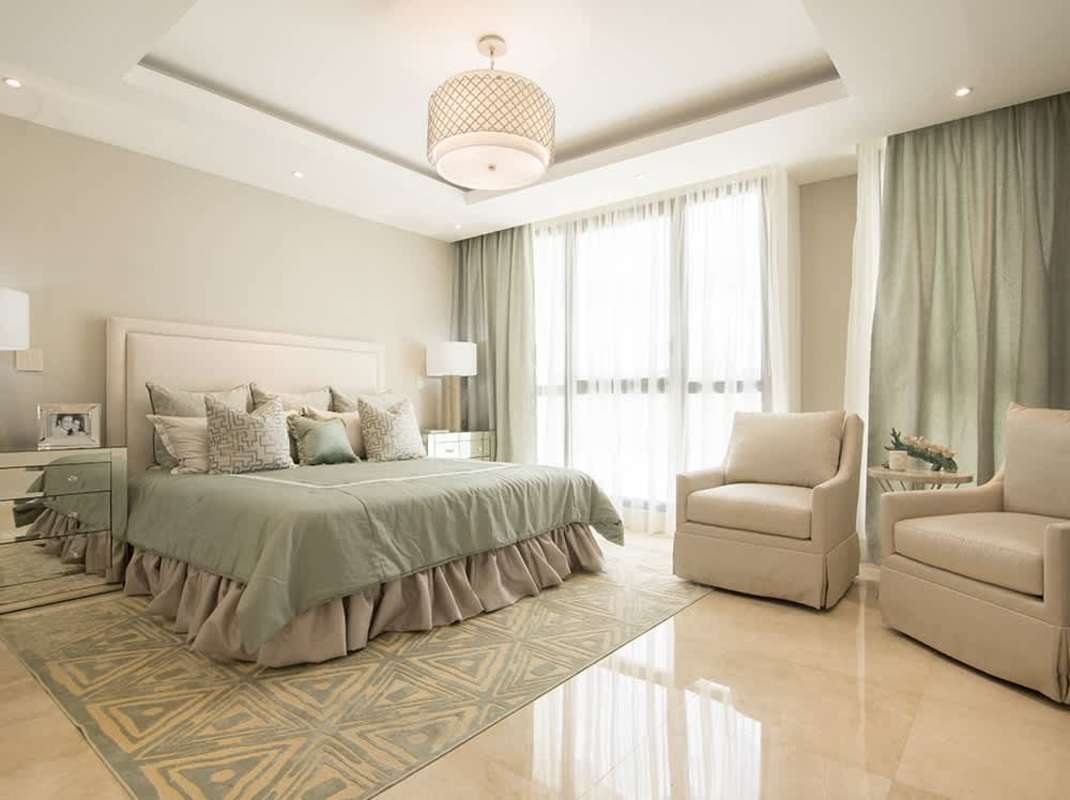 Twin beds with lavender accents in bright bedroom The Colonial Santa María Panama