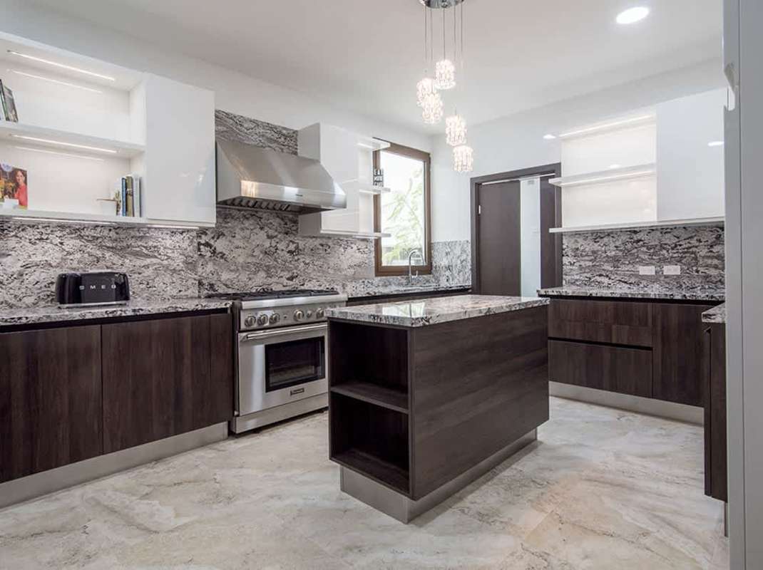 Rooftop swimming pool area with sun loungers and city views at The Colonial Panama City