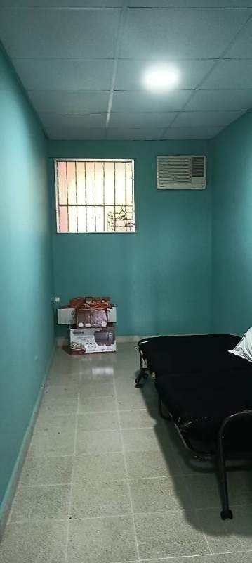 Wide living room with large window ceiling fan in Las Cumbres house for sale Panama City