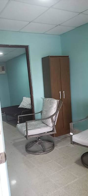 Kitchen with wooden cabinets granite countertop appliances in Las Cumbres house for sale