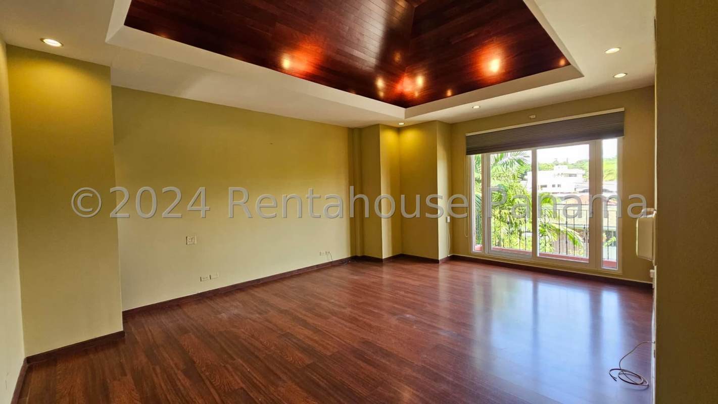 Spacious Mediterranean style living room with natural stone, marble floors in Altos del Golf house Panama City