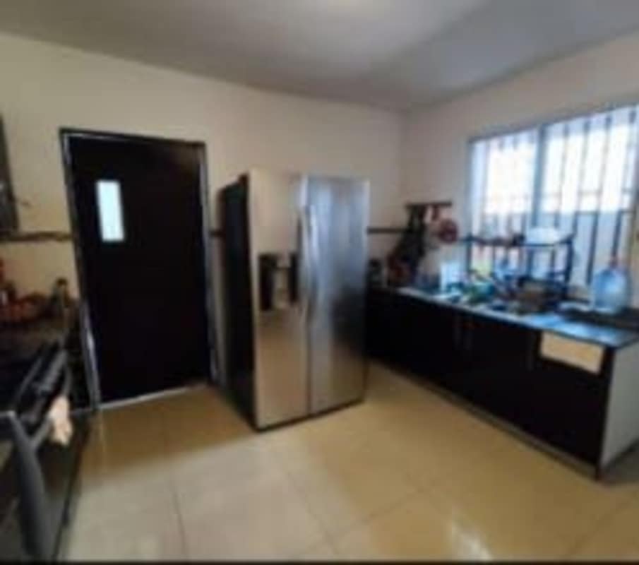 Contemporary living room with accent wall and entertainment area in El Bosque Panama City