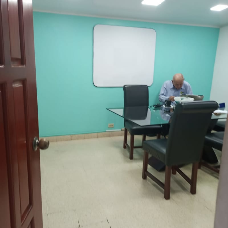 Bright office room with windows, tiled flooring, and meeting area commercial property in San Francisco Panama