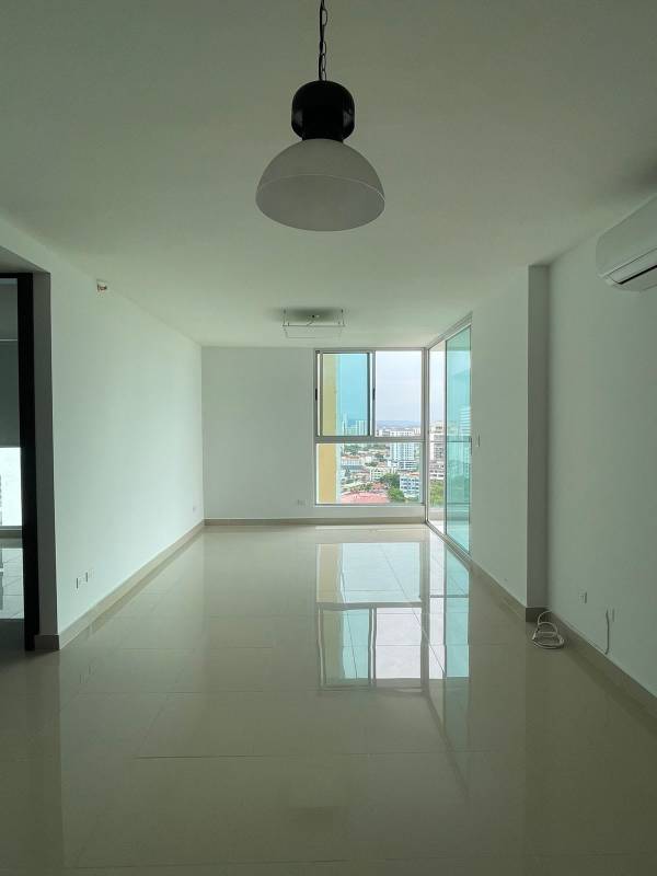 Galley kitchen with cabinets, tiled backsplash, gas stove and hood in PH Residencias del Sol Carrasquilla near Parque Omar