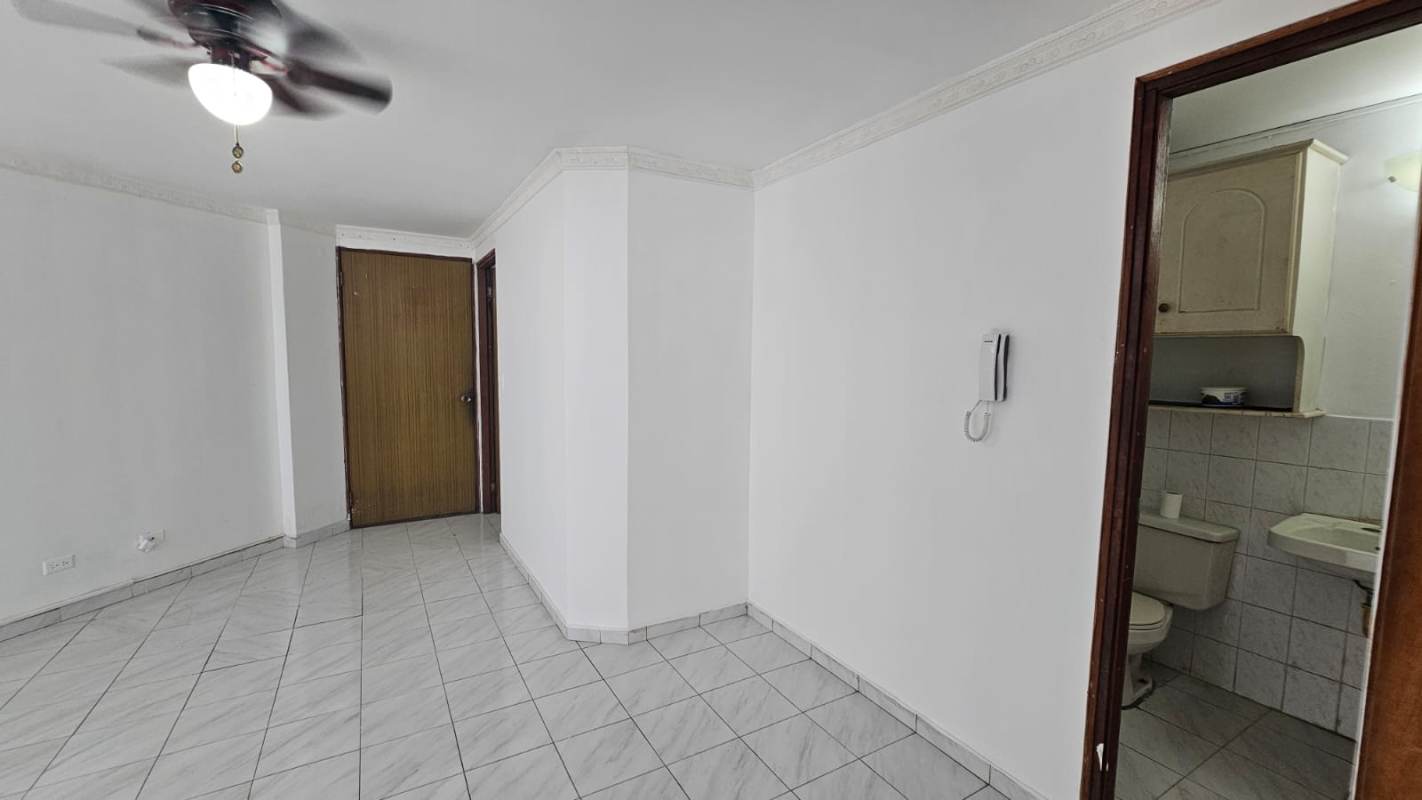 Traditional kitchen with granite counter, tiled backsplash, and vent window PH Plaza de Lourdes Panama