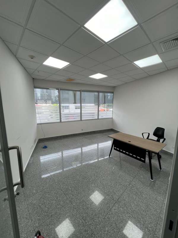 Bright private office room with polished tile, glass door, large window in Plaza Fidanque Panama