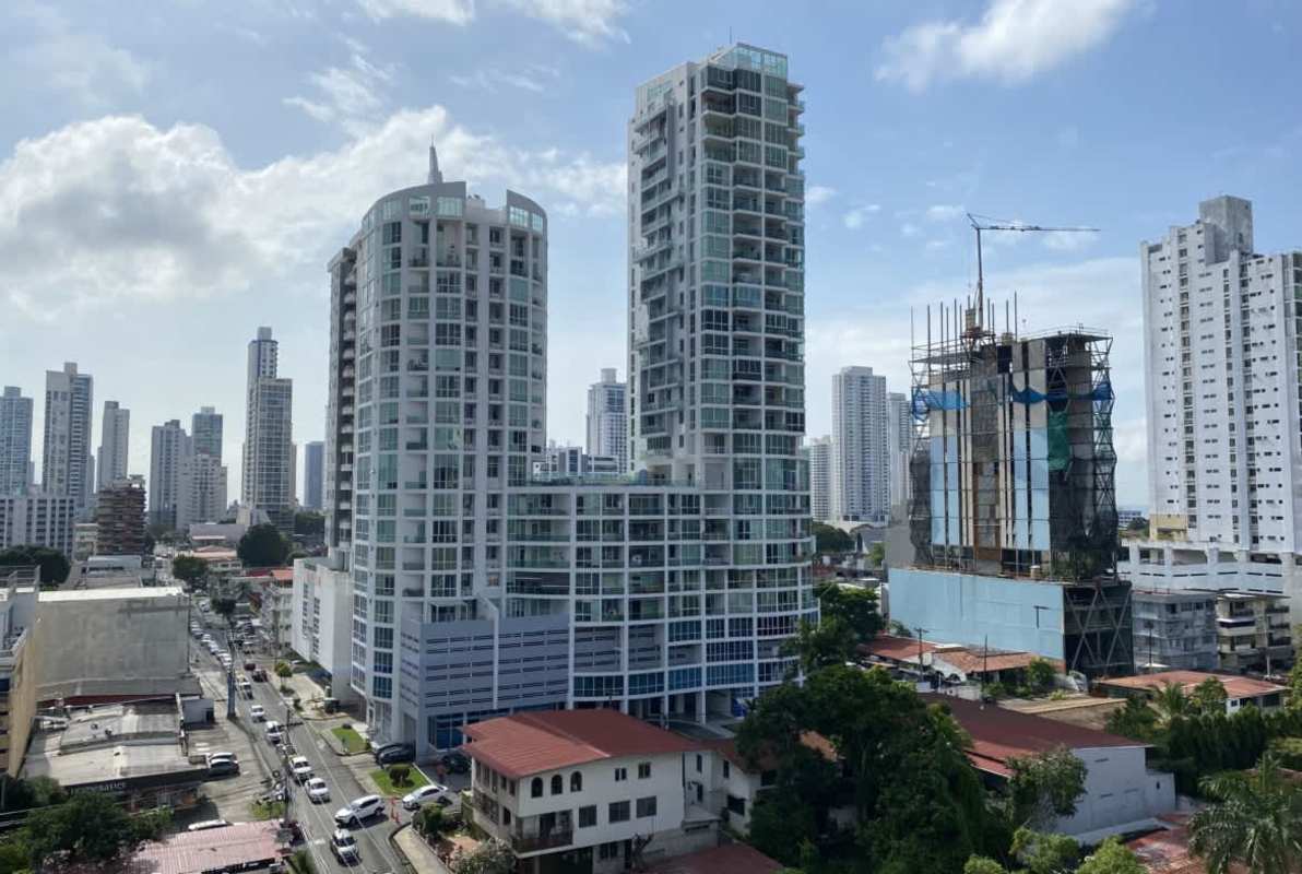Outdoor rooftop swimming pool area with skyline background at The Cosmopolitan San Francisco Panama