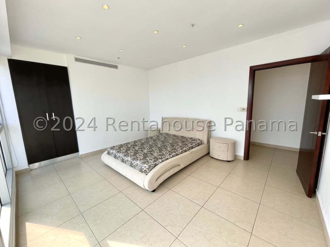 Large bedroom with seafront and skyline views in PH Rivage Panama City luxury apartment
