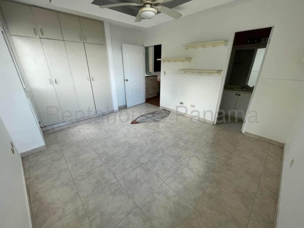 Bathroom featuring double sinks, large mirror, and glass shower in PH Oceania Edison Park Panama