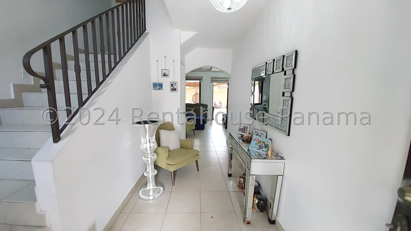 Open living and dining area with tile floors, ceiling fans, comfortable seating in Provenza home, PH Versalles Panama