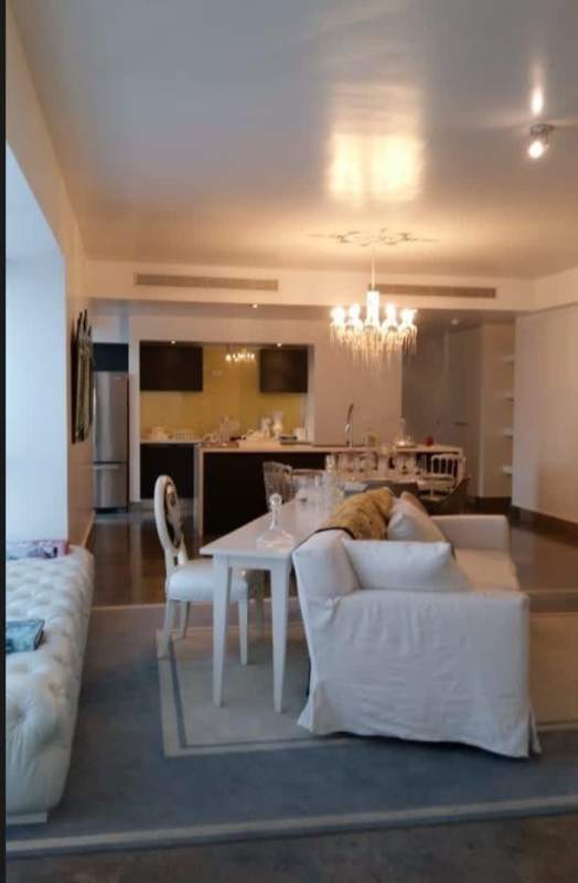 Panoramic oceanfront view through large windows and balcony at PH Yoo Panama luxury condo