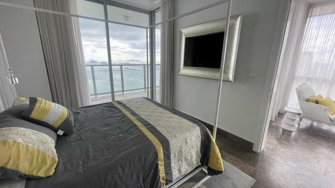 Cozy lounge area with ocean views panoramic windows at Yoo Panama condo