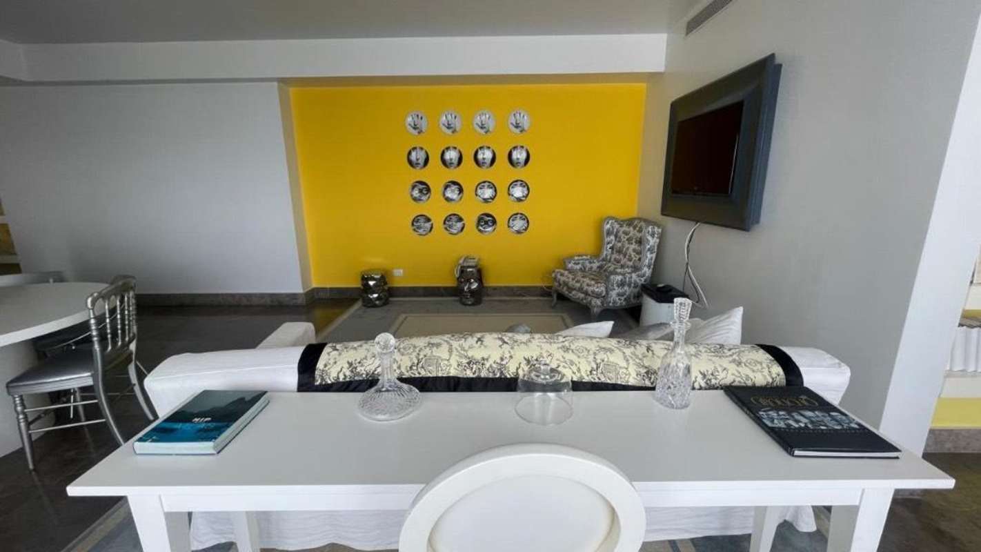 Chic lounge area open to balcony with Pacific ocean view in PH Yoo Panama