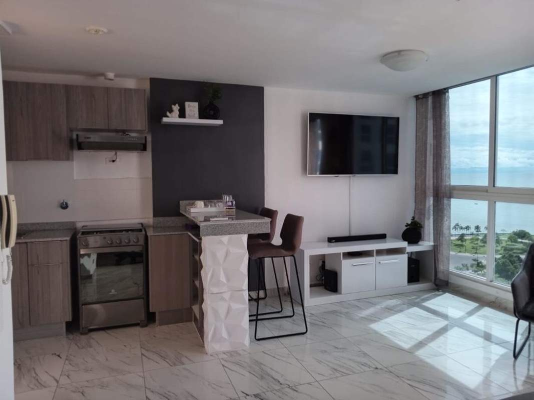 Open-plan kitchen with granite countertop and ocean views at PH The Sands in Panama City