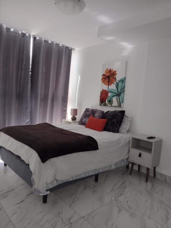 Modern bedroom with stunning ocean view, large closet and ensuite bathroom at PH The Sands Panama City