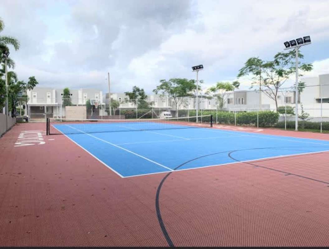 Multi-use sports court with tennis net and basketball hoops within Brisas del Golf Panama