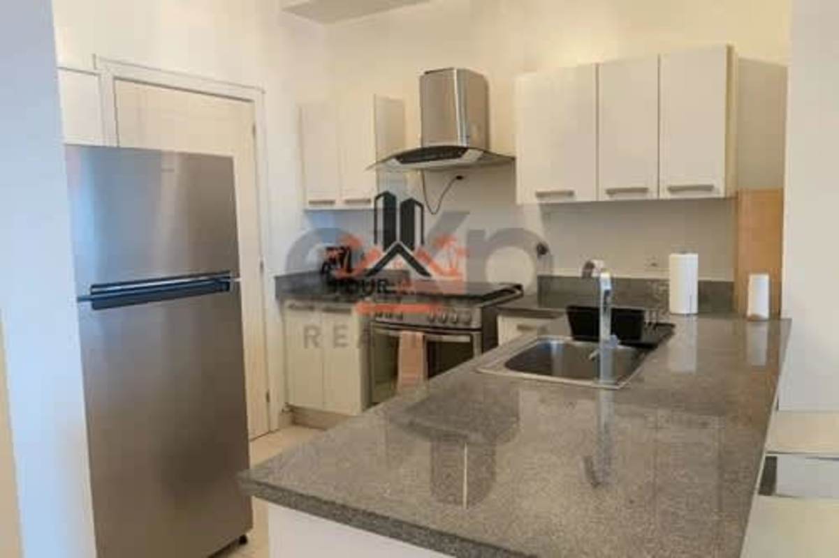 Kitchen with granite countertops, stainless appliances at PH Waters on the Bay Panama