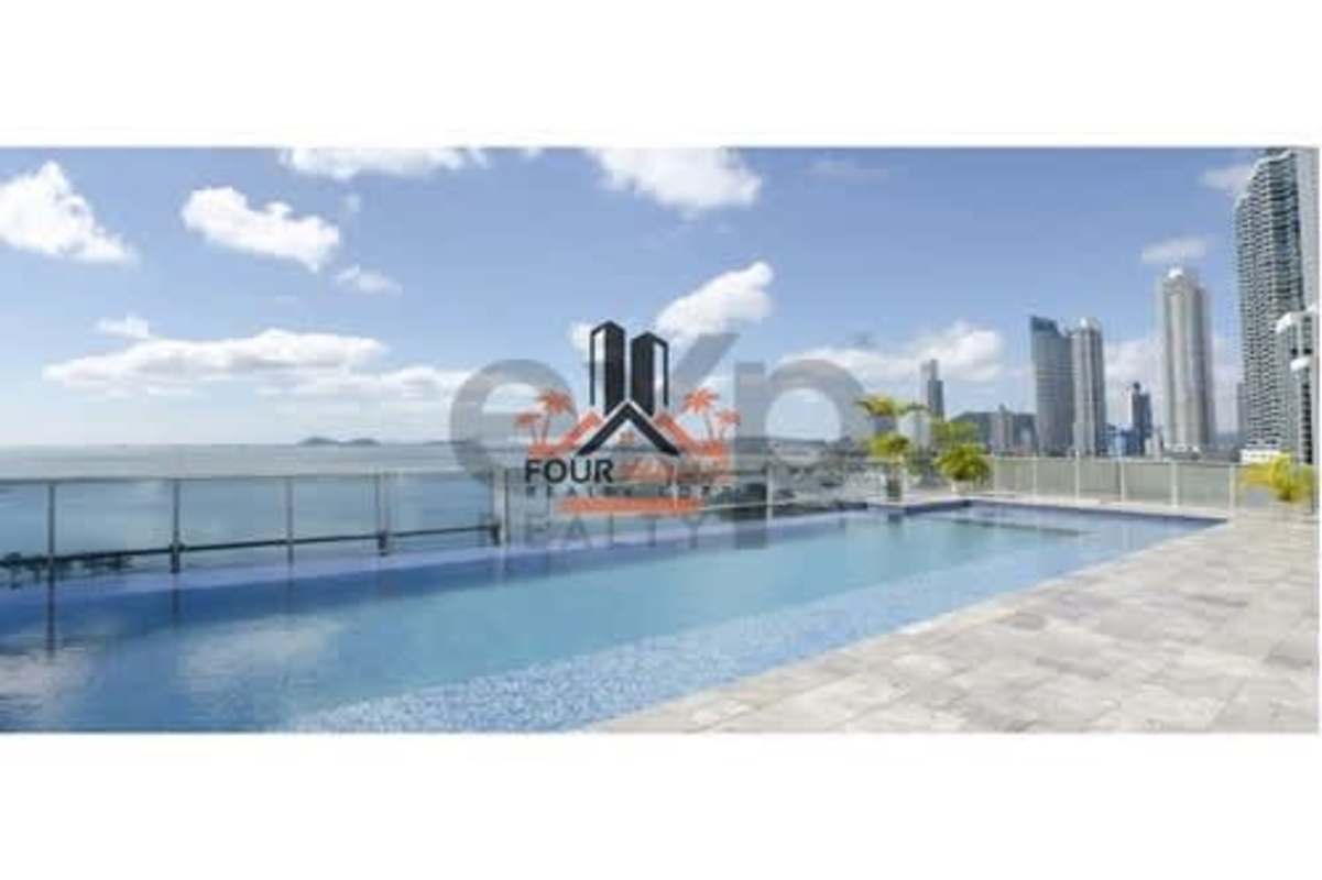 Modern rooftop infinity pool overlooking the ocean and Panama City skyline at PH Waters on the Bay