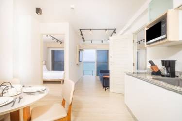 Contemporary bathroom with glass shower enclosure at Surfside Playa Caracol beach condominium Panama