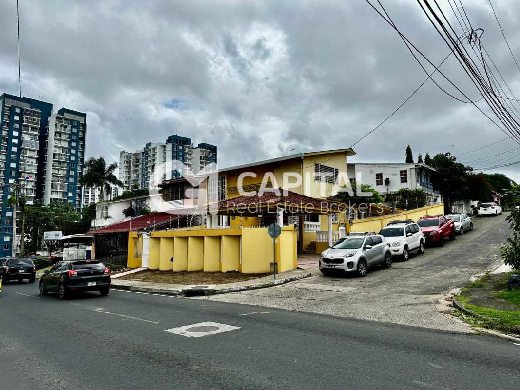 Kitchen with wood cabinetry, granite countertops, oven and cooktop in Club X Betania Panama House