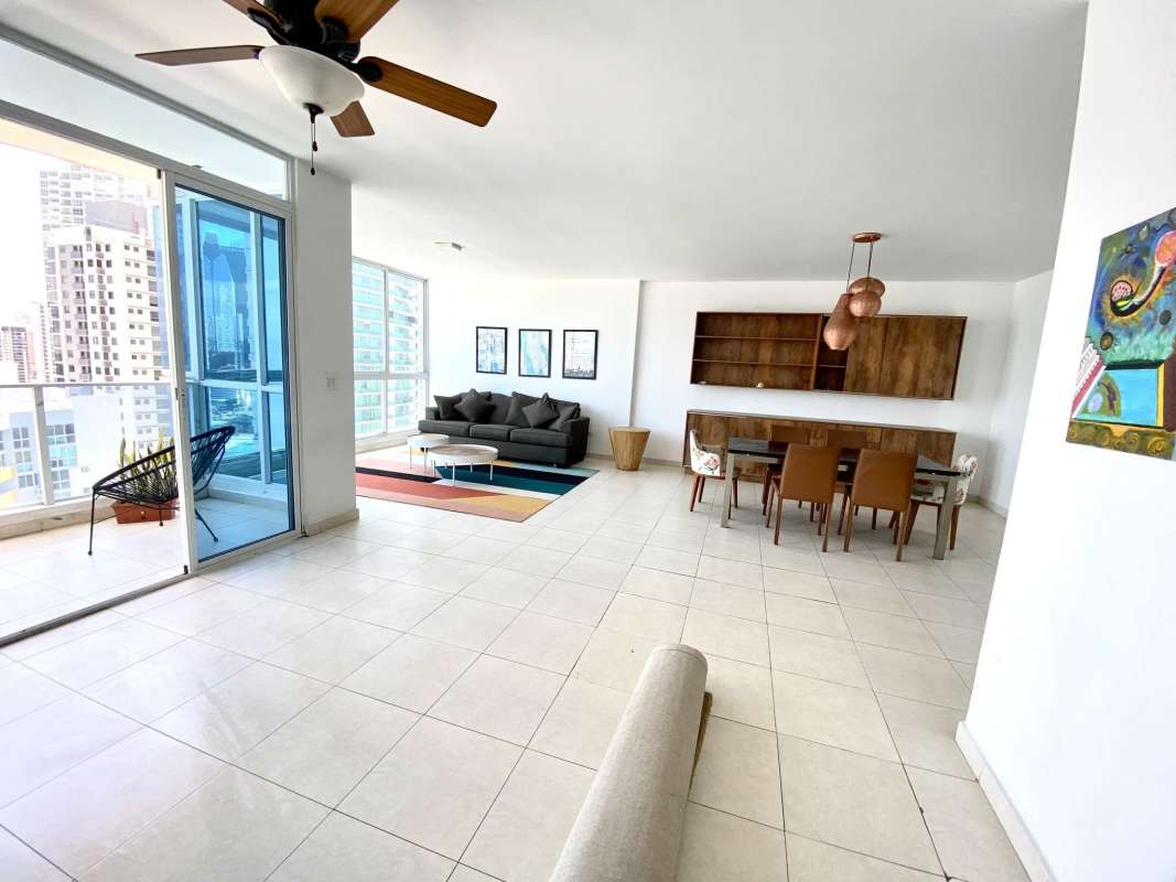 Spacious living and dining room with ocean view windows in PH BICSA Panama City