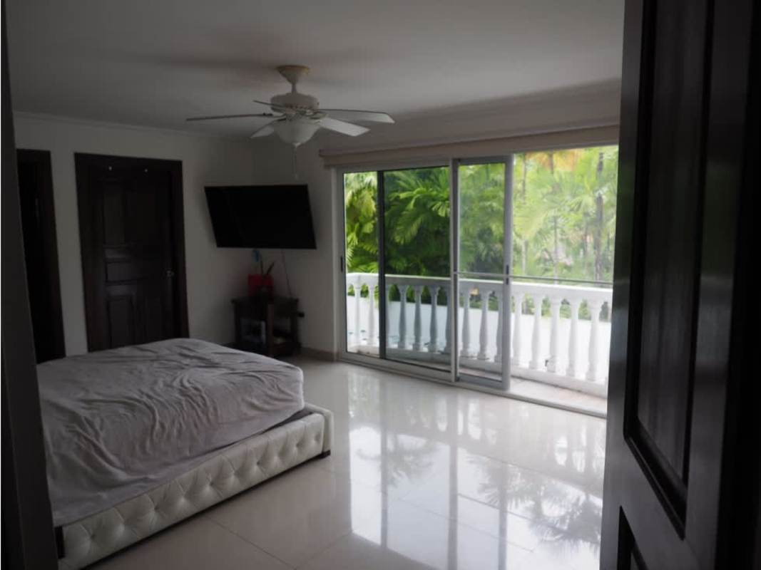 Spacious master bedroom with balcony, large windows, walk-in closet in Altos del Golf Panama