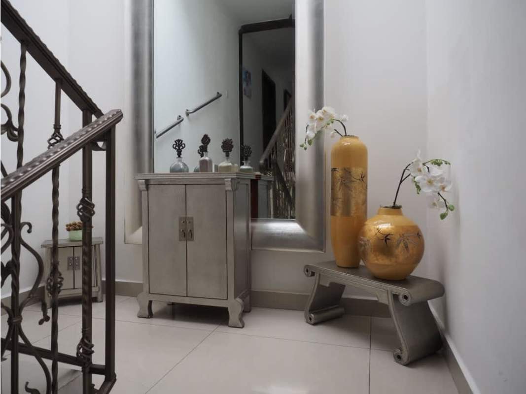 Private swimming pool surrounded by landscaped garden in luxury house Altos del Golf