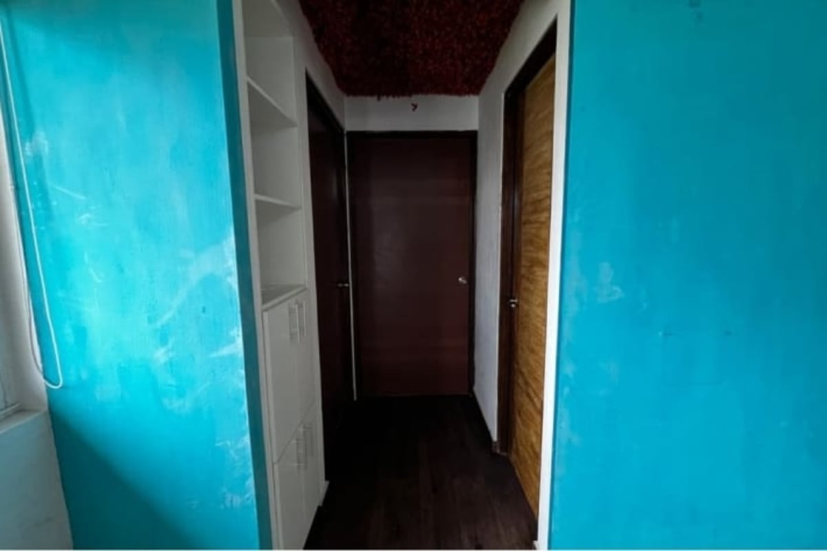 Modern kitchen with subway tile backsplash and black countertops at PH Carmen Edith Panama