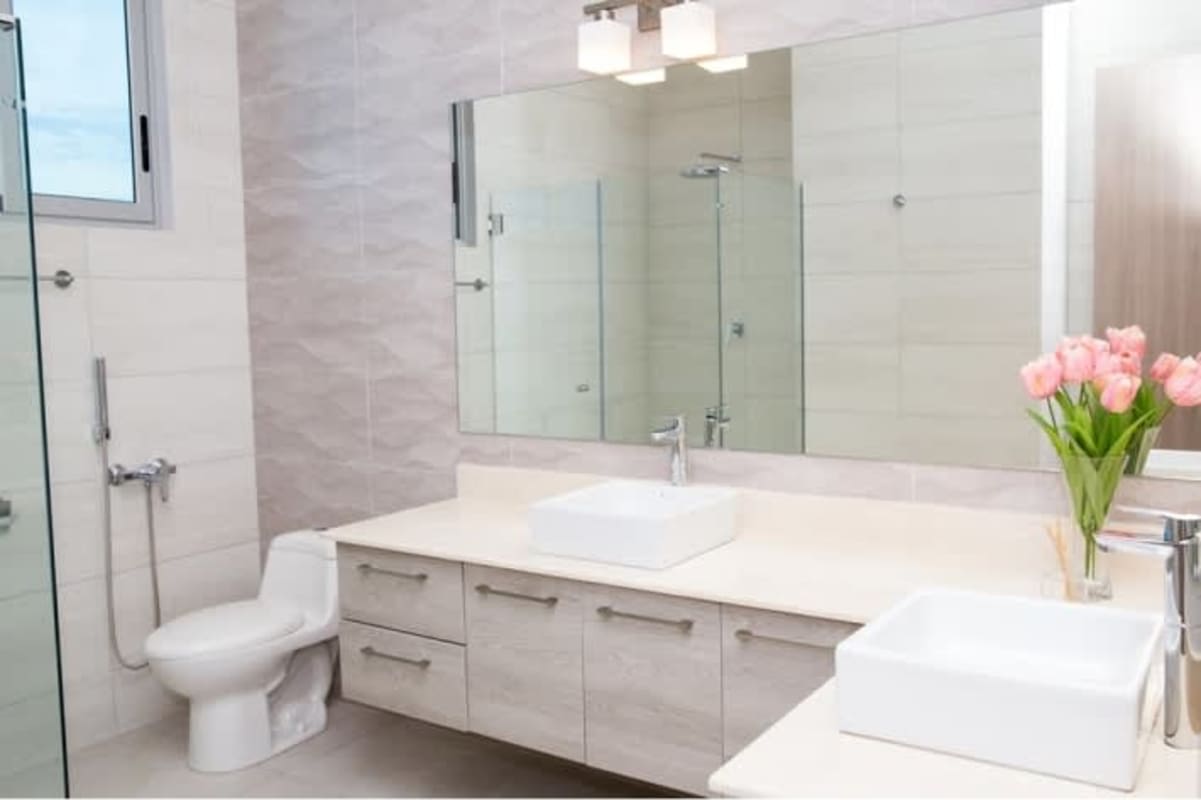 Bright open plan living and dining room with large windows PH Dos Mares Betania Panama City