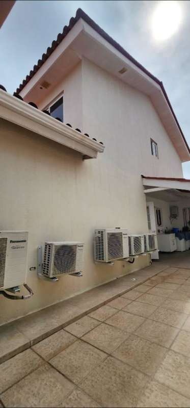 Furnished kitchen with granite countertops, wood cabinets, appliances Reserva de Versalles Panama