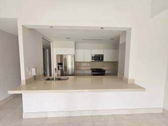 Bedroom with large window overlooking garden lagoon at PH Laguna Buenaventura condo