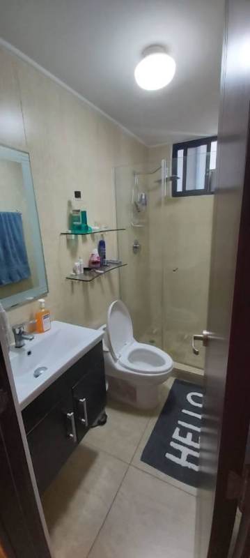 Galley kitchen with tile floor, wood cabinets, window, appliances PH Terrazas del Rey Condado del Rey Panama