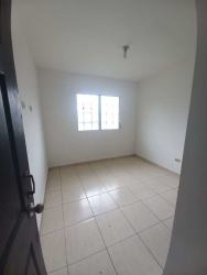 Empty bedroom tiled floor window bars Residencial Aqualina house David Panama