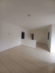 Spacious tiled living dining space with large windows house in Aqualina David Panama