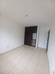 Bedroom with built-in wardrobe and ceramic tile floor in Residencial Aqualina house Panama