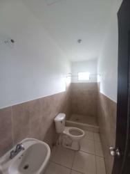 Basic bathroom with walk-in shower tiled walls in Residencial Aqualina David Panama