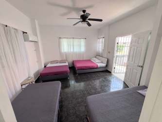 Simple white tiled bathroom with shower in Punta Chame beachfront house for sale