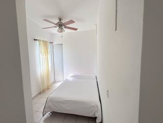 Covered tropical gazebo with barbecue grill billiard table and ceiling fans at Punta Chame beach villa