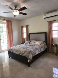 Second bedroom with large windows and greenery view rural property in El Espino San Carlos