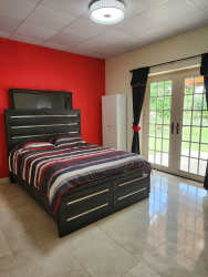 Spacious bedroom with garden views, terrace door, and walk-in closet in rural home Panama