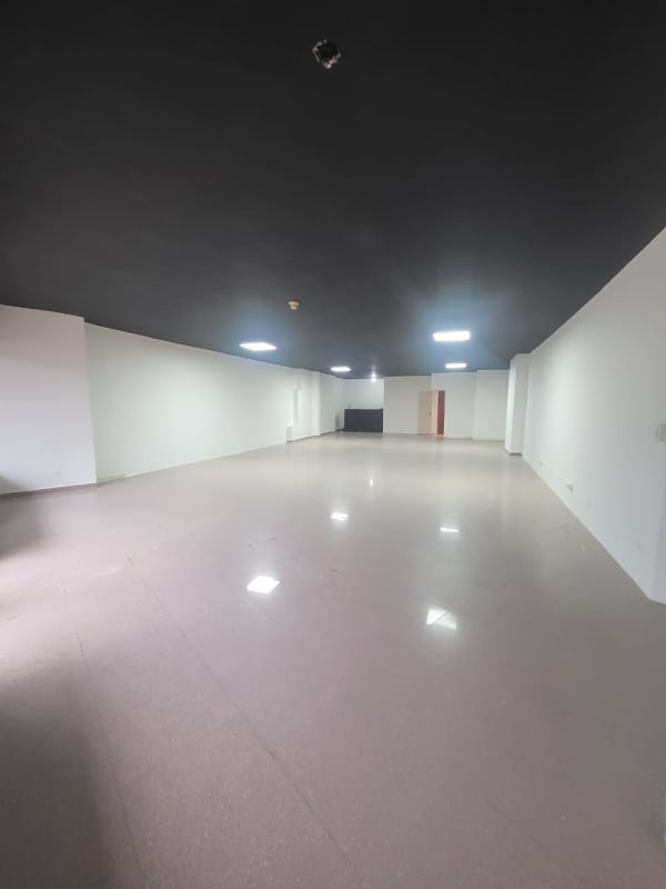 Street view of PH Kitaen building with glass storefronts Via España La Cresta Panama