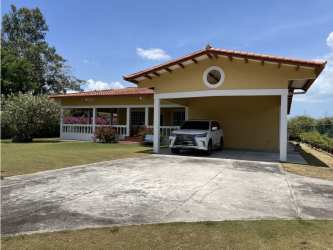 Open plan living dining with ceiling fans garden views in Coronado Golf Resort Panama