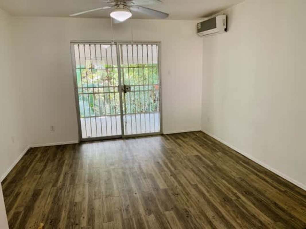 Living room with sliding glass doors and AC multi-unit Clayton apartment Panama