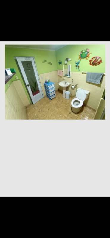 Bedroom with tiled floor, ceiling fan, open closet in Paraíso San Miguelito house